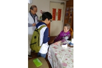 Trained volunteers conduct home visits to measure blood pressure for the elderly.